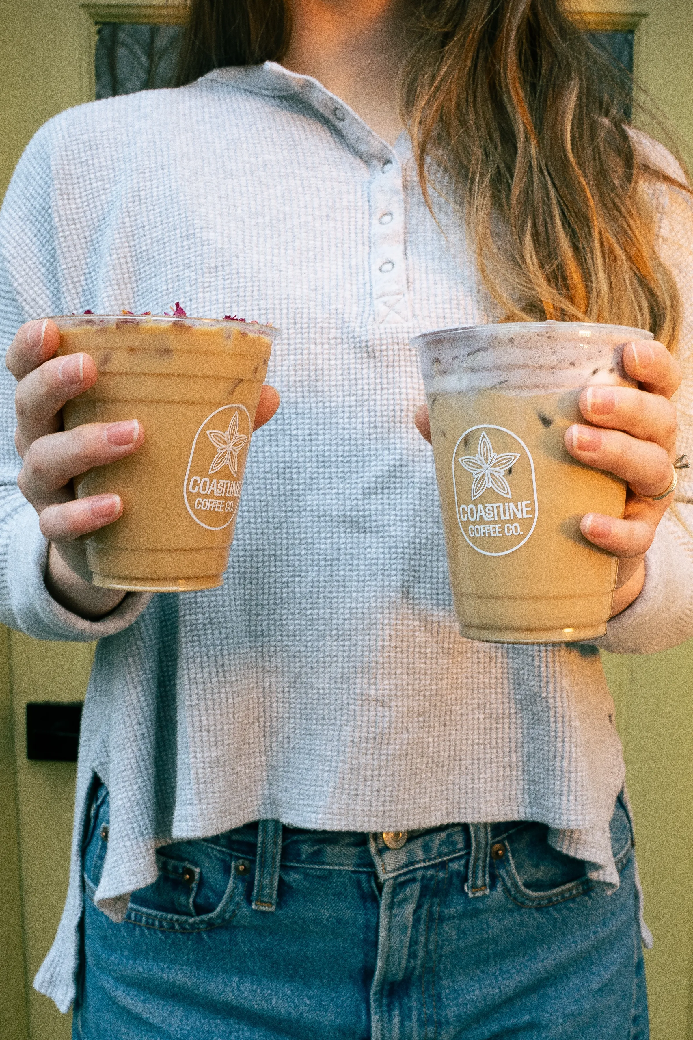 Two iced lattes in Coastline Coffee cups