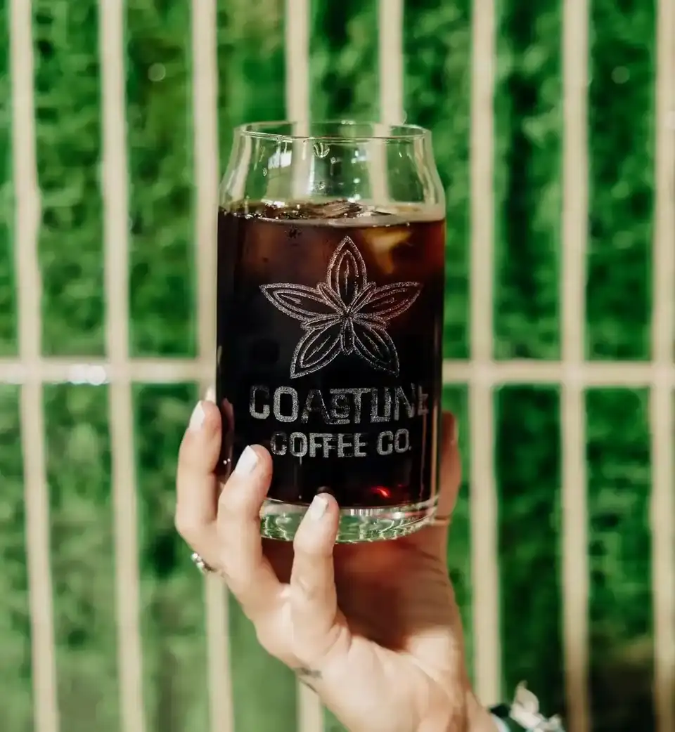 Iced drink in a Coastline Coffee glass